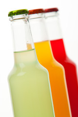 bottles with tasty drink in ice