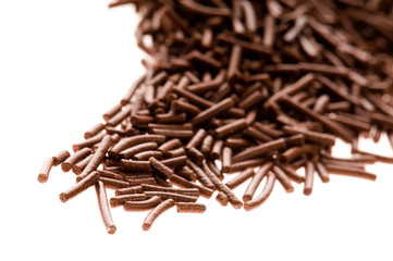 chocolate sprinkles on white background