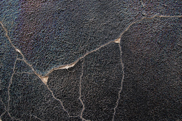 cracks in a grungy wall