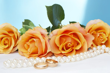 wedding roses with necklace and gold rings