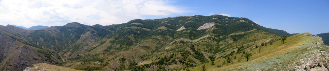 panoramic view of range of hills.