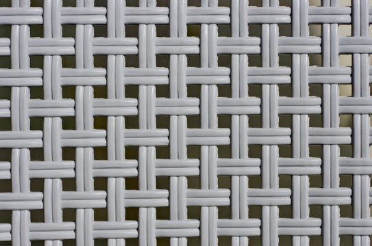 Plastic grille with small square holes for background