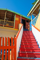 Red Steps Past Orange Fence