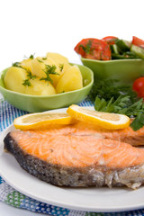 Grilled salmon with potatoes and salad