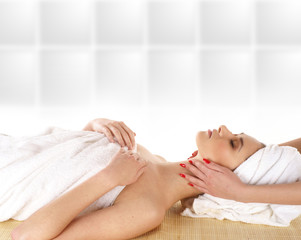 A young and attractive woman is getting spa treatment