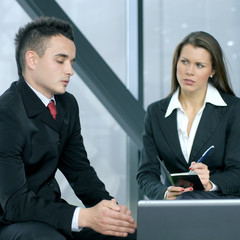 A young business woman interviewing a business man