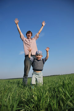 Father and son have fun - hands up!
