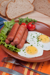 Breakfast fried eggs and sausages