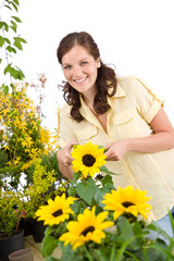 Gardening - woman with sunflower and pruning shears
