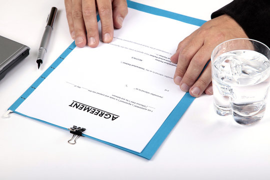Businessman reading Contract Agreement