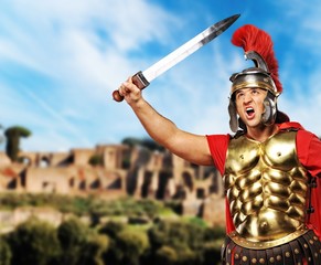 Roman legionary soldier in front old city of Rome