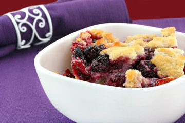 Berry cobbler in a bowl.