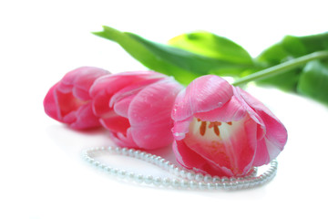 Pink tulips and pearl necklace