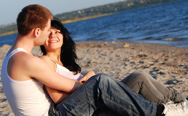 Fototapeta premium Young couple on the beach