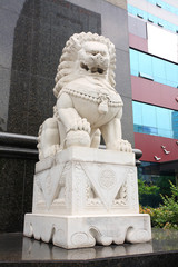 Stone lion sculpture in front of the building