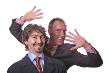 Two young business men portrait on white.