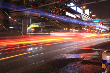 Fototapeta na wymiar Urban night traffics view. Focus on the road. .