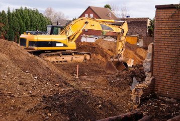 Excavator at demolition site