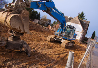 Excavator at demolition site