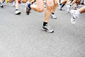 Fototapeta premium Marathon runners. Motion blur on running legs