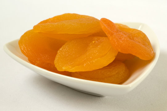 Dried apricots on plate