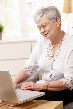 Senior woman browsing internet