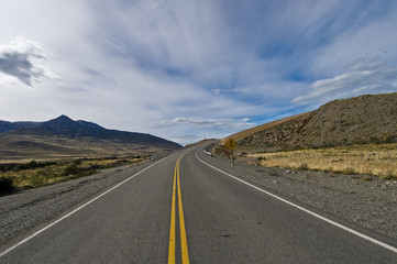 vibrant image of highway and blue sky