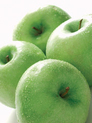 four fresh green apples