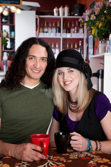 Interracial couple sitting together at a cafe