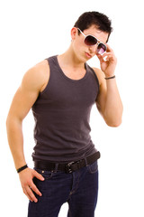 Obraz premium Portrait of stylished young man wearing sunglasses on white back