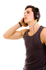 Young man listening music isolated on white