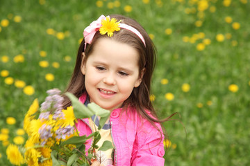 Happy little girl in the meadow