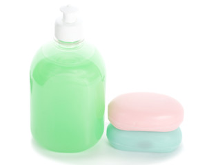 liquid soap and two bars of toilet soap