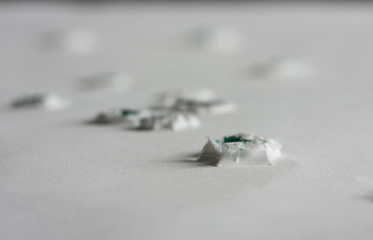 Bullet holes in paper