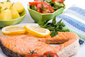 Grilled salmon with potatoes and salad