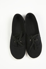 a pair of black women shoes and white background