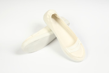 a pair of white women shoes and white background