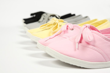 grey ,pink,yellow  and black women shoes with white background