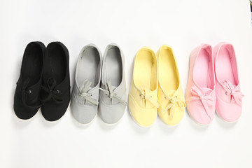 grey ,pink,yellow  and black women shoes with white background