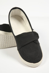 a pair of black women shoes and white background