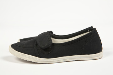 a pair of black women shoes and white background