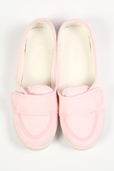 a pair of pink women shoes and white background