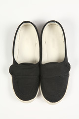 a pair of black women shoes and white background