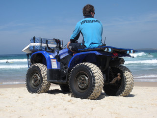 Fototapeta na wymiar Bondi Beach Lifeguard on Beach Buggy
