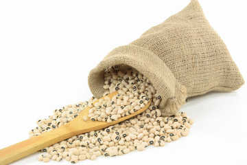 Spilled Black Eyed Peas over wooden spoon.