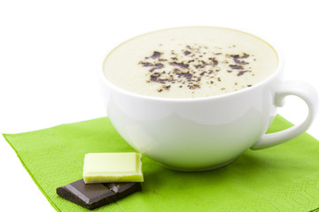 cup of cappuccino, chocolate  on a napkin