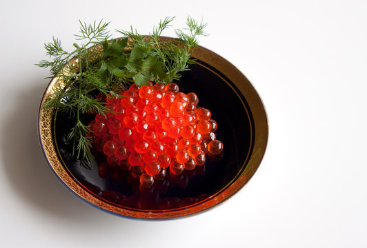 Red caviar and fennel branches