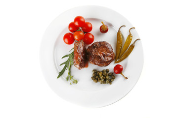 grilled meat medallion served on white
