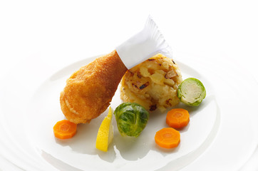 Fried chicken leg with mashed potato and vegetable