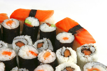 mixed sushi types on white